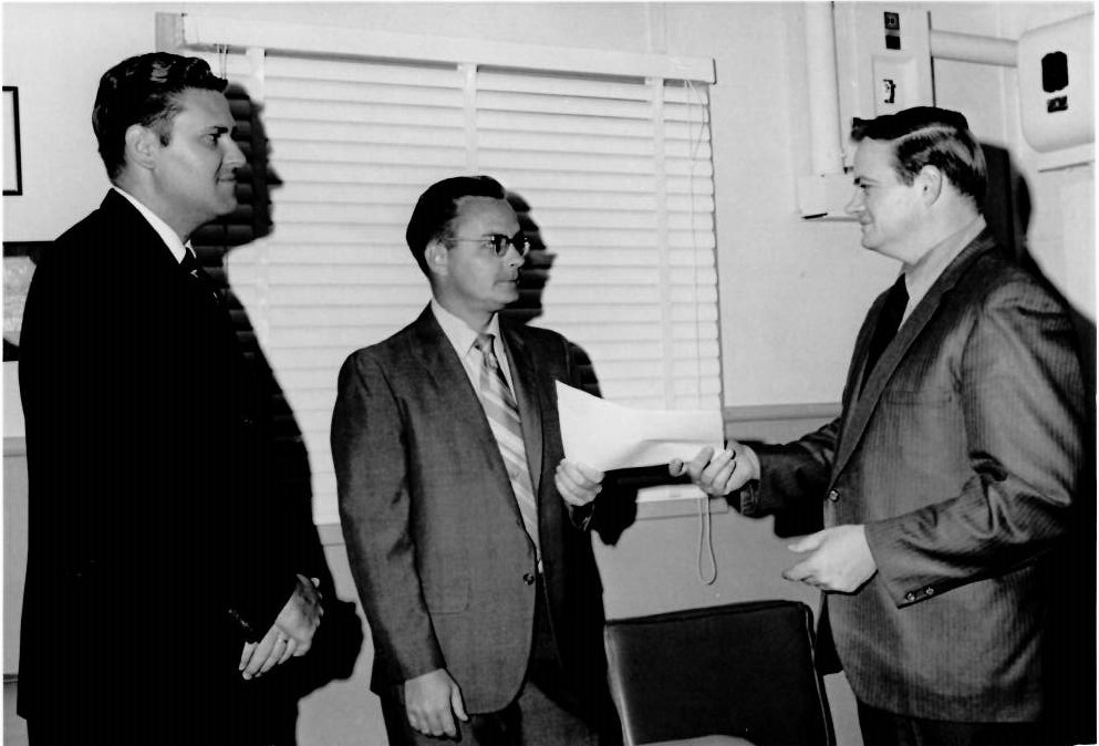 Figure 2: Dan Armstrong receiving an award from the head of his division.